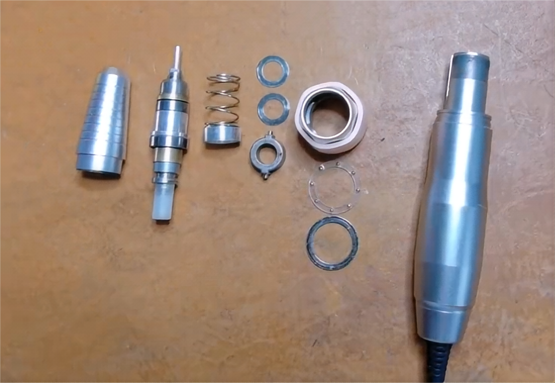 The construction of a nail drill handpiece